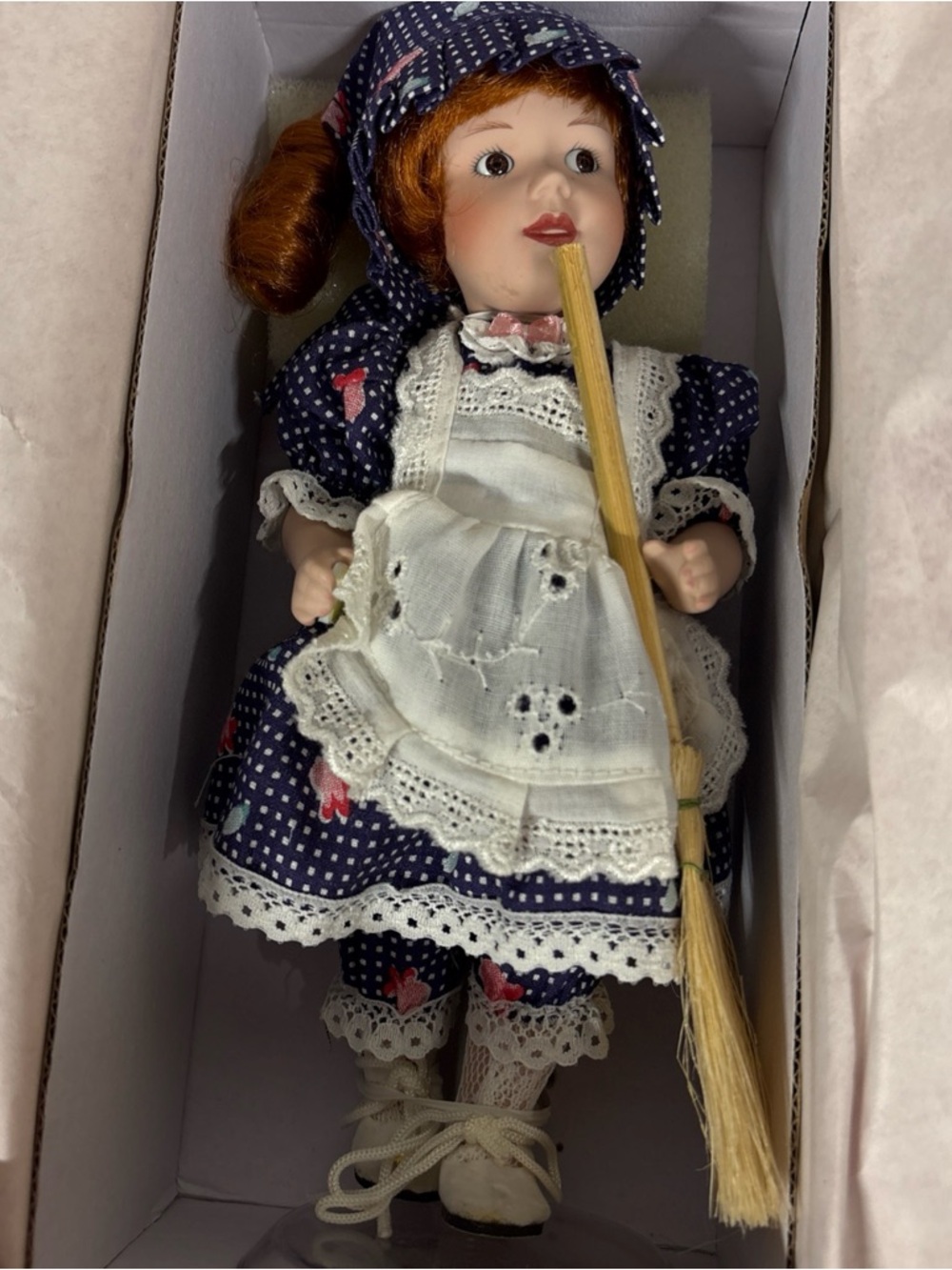 Paradise Galleries Porcelain Doll in Navy Blue Floral Dress with White Apron